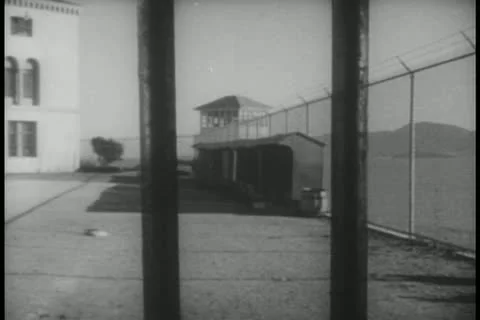 View of prison yard fom behind bars Stock Footage 11348601