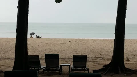 View to private beachfront hotel with lounge beach chair face to the sea wi.. Stock Footage 285296720