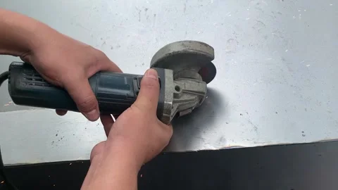 View of process cutting iron plates using a grinder 스톡 동영상 324612350