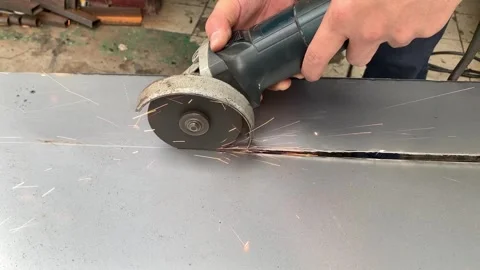 View of process cutting iron plates using a grinder 스톡 동영상 324612351