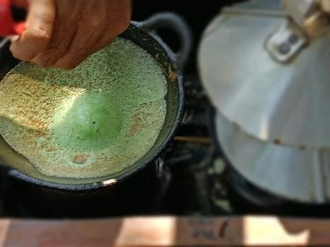View of the process of making pancakes on the street Stock Photos