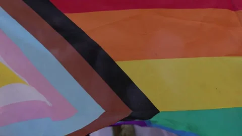View of the Progress Pride flag waving during a public event, Portugal. Video stock 335026685