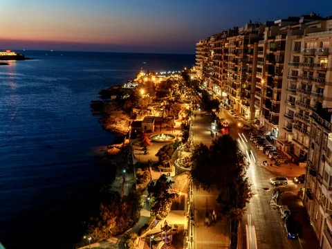 View at promenade and St Pauls harbour bay in Malta by night 4k Time Lapse Stock Footage 79325341