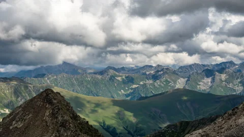 View of Puffy clouds above mountains Stock Footage 143970324