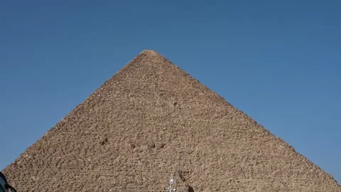 View Of The Pyramid of Cheops Against A Clear Blue Sky in Egypt Stock Footage 271141002