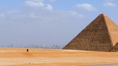 View of the Pyramid of Kheops with Cairo in the distance Stock Footage 96216841