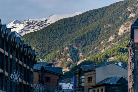 A view of the Pyrenees mountains range with the old traditional buildings and Stock Photos