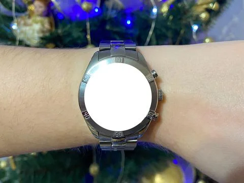 A view of the quartz watch dial with a stainless steel strap on the arm Stock Photos