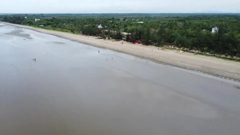 View of a quiet beach, with a beautiful stretch of sand in Pagatan Stock Footage 264797511