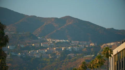 A view of quiet southern town with rows of houses on the mountain slopes Stock Footage 281874607