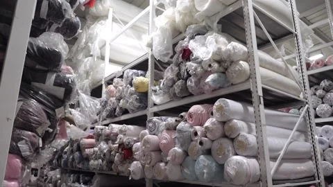View of a rack with rolls of multicolored fabrics Vídeos de archivo 165237079