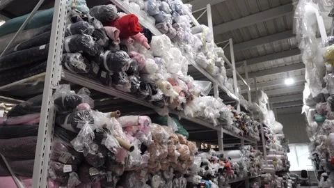 View of a rack with rolls of multicolored fabrics Video stock 165237096
