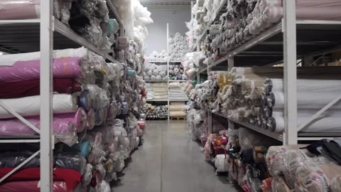 View of a rack with rolls of multicolored fabrics Vídeo Stock 165812352