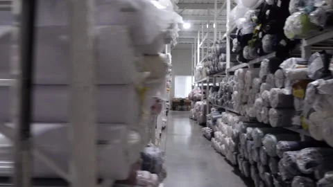 View of a rack with rolls of multicolored fabrics Video stock 167787628