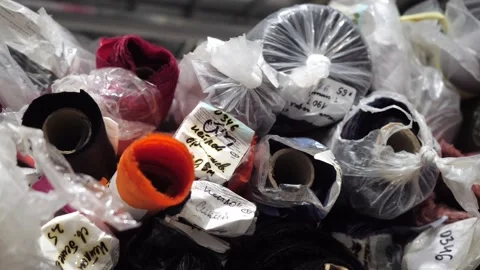 View of a rack with rolls of multicolored fabrics Video stock 221231726