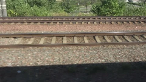 View on rail track from window of moving train Stock Footage 139113005