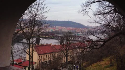 View of the railroad bridge over the Vltava River, taken through the arch of the Stock Footage 264669455
