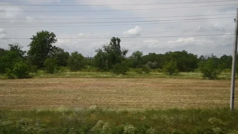View from the railway car to the landscape passing outside the train window Видео 211166718