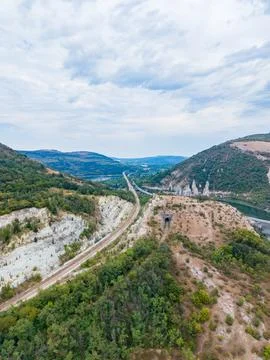 View of a railway line running through hills and valleys with rocky formati.. Stock-Fotos