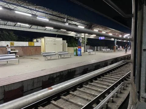 A view of Railway Platform from train window in night Stock Photos