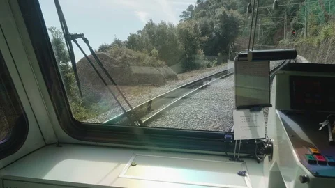 View of railway from window of train slowing before turning. Red light of Stock Footage 115544308