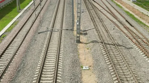 Up view of railways and electrical train passing by. Stock Footage 135574819