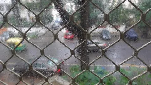 View of Rain drops from window during the Monsoon season. Stock Photos