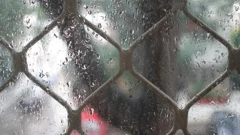 View of Rain drops from window during the Monsoon season. Stock Photos