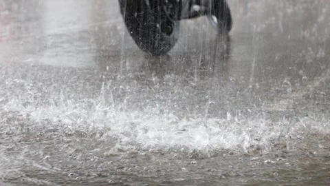 View of rain falling on a wet street in Vilnius, Lithuania. Stock Footage 340641532