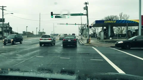 View of the Rain through the Windshield Wipers on a Car Stock Footage 62996254