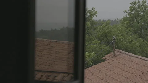 View of a rainstorm from the window Stock Footage 160157399