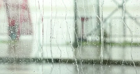 View of a rainy day trought a window with droplets of water Stock Footage 199300202