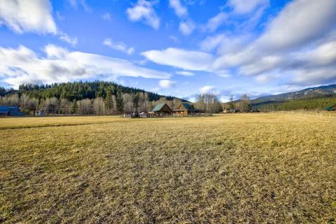 View of ranch home situated in a beautiful valley. Northwest, USA Stock Photos