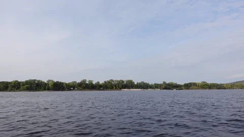 View of the rapid flow of a river or lake. Journeys 動画素材 194357091