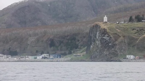 View of Rausu lighthouse on a rugged cliff, Japan. Vídeos de archivo 343680132