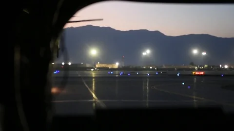 View from rear of CH-47 of helicopter hovering on runway at night Afghanistan Stock Footage 87205989