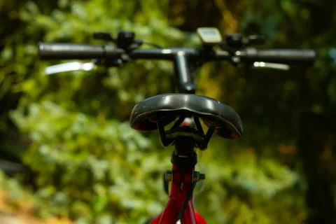 View from rear side on a cycle seat and blured  cycle handlebar Stock Photos