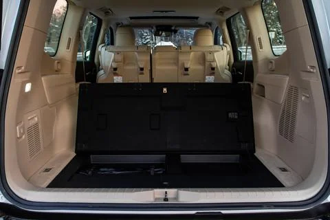 View of the rear storage area in a SUV car. Clean, open empty trunk. Stock Photos