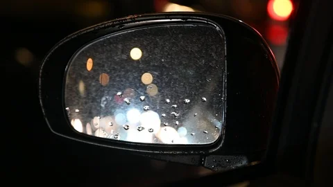 View on the rear view mirror of the car in the night. Indistinguishable lights Stock Footage 121783655