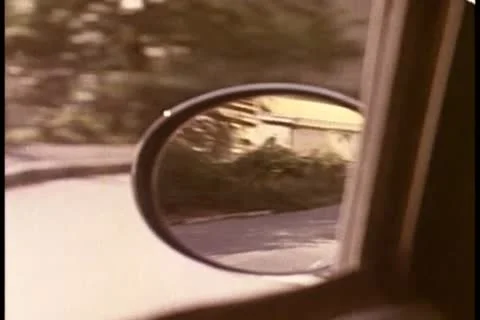 View from rear view mirror in moving car Видео 11345824