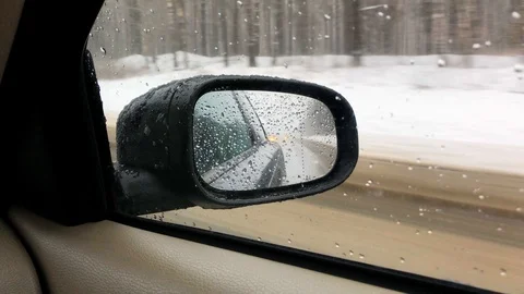 View of the rear view mirror while driving on the high way Stock Footage 101194788