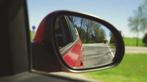 View in the rear view side mirror of a a... | Stock Video | Pond5