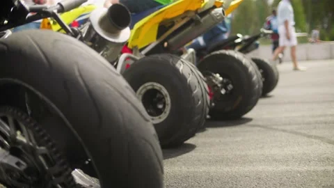 View of the rear wheels of the ATV and motorcycle. Stock Footage 130383203