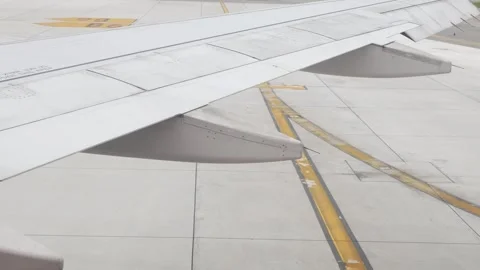 View to rear wing of airplane while aircraft pushback from gate terminal vi.. Stock Footage 294917868