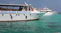 View from the recreational marine vessel at blue lagoon with swimming tourists HD Footage