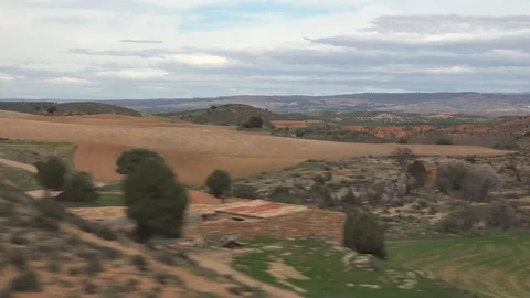 View of red arid field in Spain by day POV Point of view high speed train travel Stock Footage 81978924