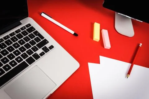 View of the red desk with a computer Stock Photos
