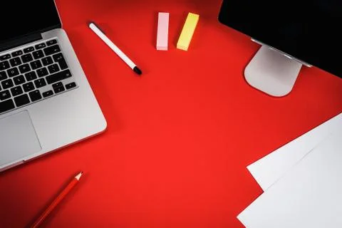 View of the red desk with a computer Stock Photos