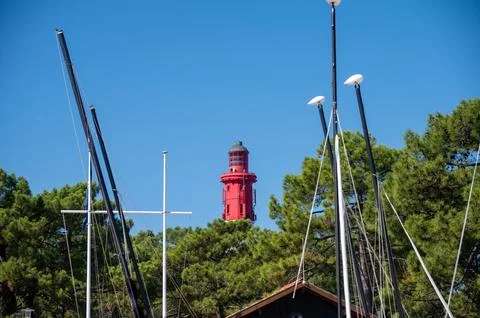 View on red lighthouse Le Phare du Cap Ferret, Arcachon Bay with many fishe.. Stock Photos