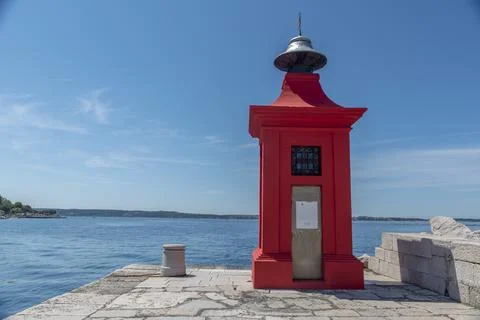 View of the red lighthouse on a pier Stock Photos
